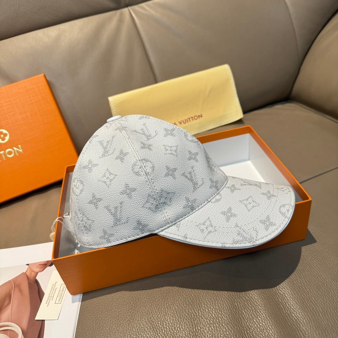 Louis Vuitton monogram baseball cap, light gray canvas with curved brim and panel stitching.