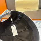 Louis Vuitton cap interior, black fabric with size label and adjustable strap.