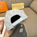 Louis Vuitton monogram baseball cap, light gray with black inner band and hang tag.