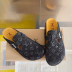 Louis Vuitton patterned sandals on box, dark gray uppers with metal buckles and yellow lining