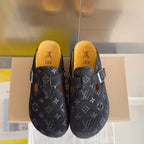 Louis Vuitton patterned sandals, front view showing dual buckles and yellow insoles on dark gray