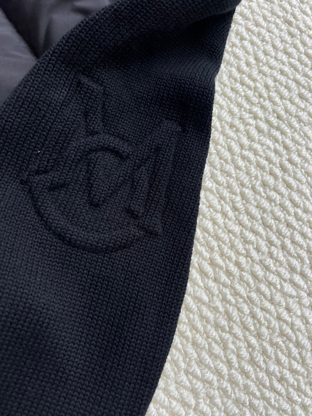 Moncler knit logo patch on jacket sleeve cuff, dark navy