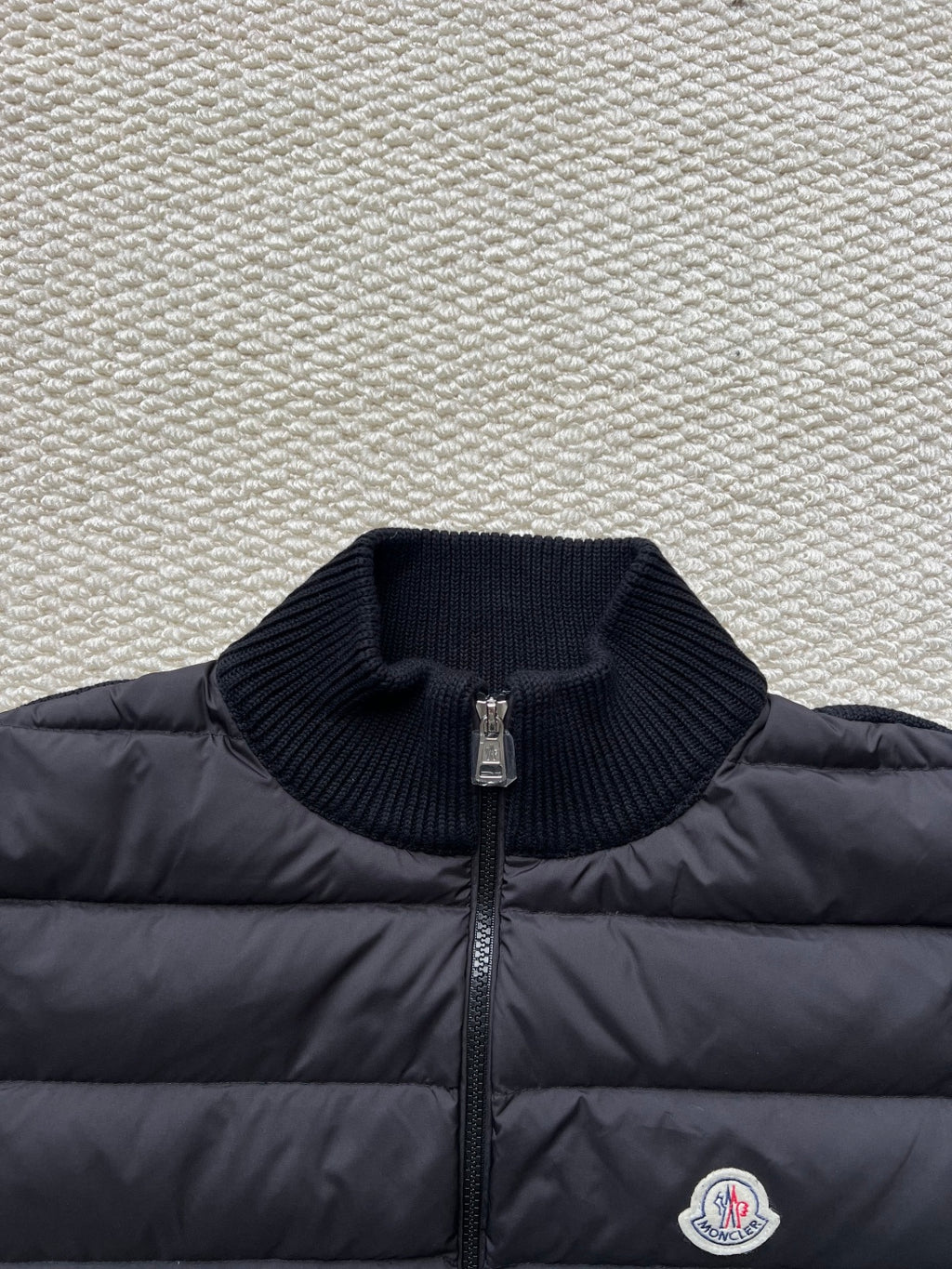 Moncler long puffer jacket close-up of knit stand collar and front zipper