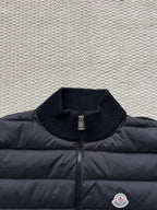 Moncler long puffer jacket close-up of knit stand collar and front zipper