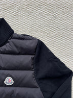Moncler long puffer jacket side view with sleeve knit cuff and small logo patch