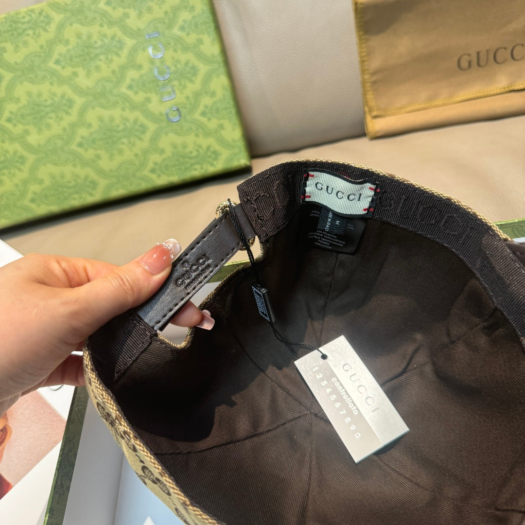 Gucci cap inside view: black strap, tan GG canvas edge, hanging tags