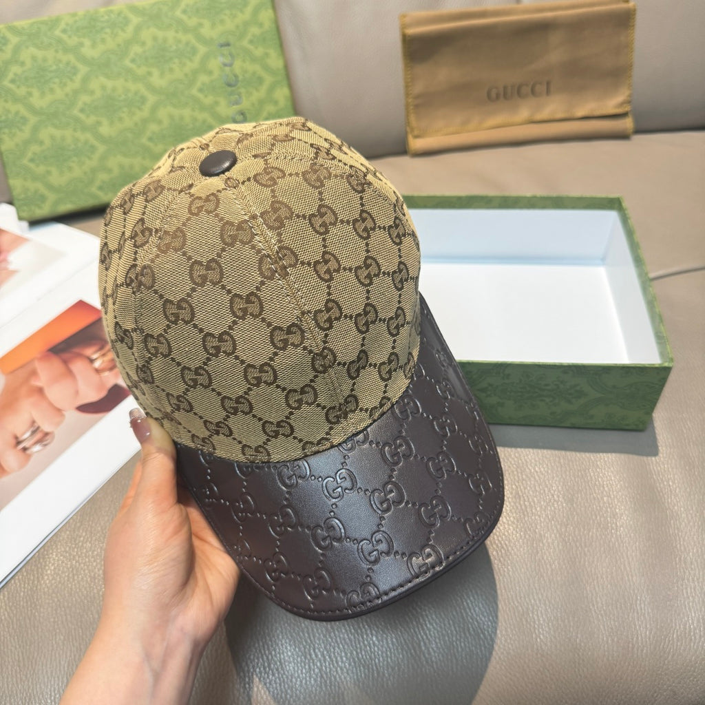 Gucci cap closeup: beige GG crown with dark leather-look brim, snap button