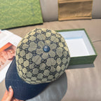 Gucci GG monogram baseball cap with dark blue brim and front button detail