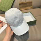 Gucci monogram baseball cap in light gray with textured logo fabric and curved brim