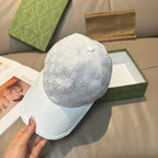 Gucci monogram baseball cap in light gray with white logo pattern and curved brim