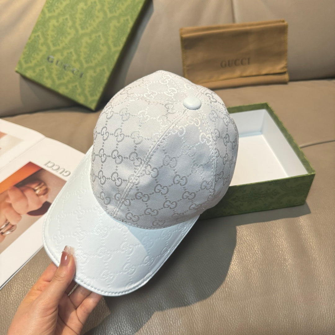 Gucci monogram baseball cap in light gray with white logo pattern and curved brim