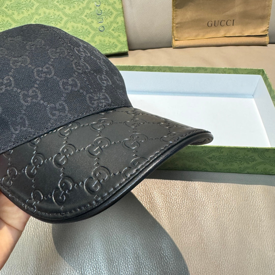 Dark navy GG monogram baseball cap side panel with curved leather-like brim