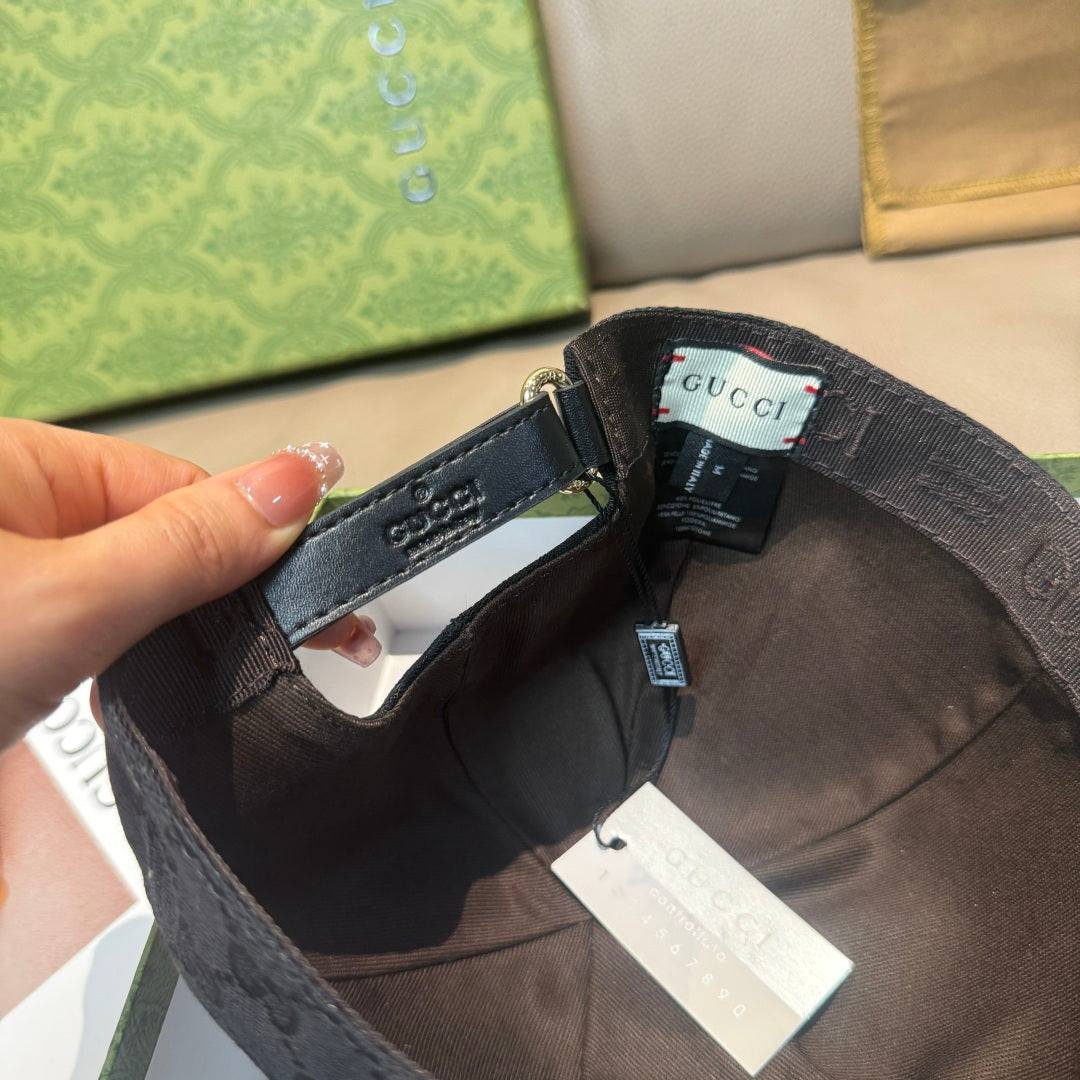 Inside of dark navy GG baseball cap with adjustable strap and product labels