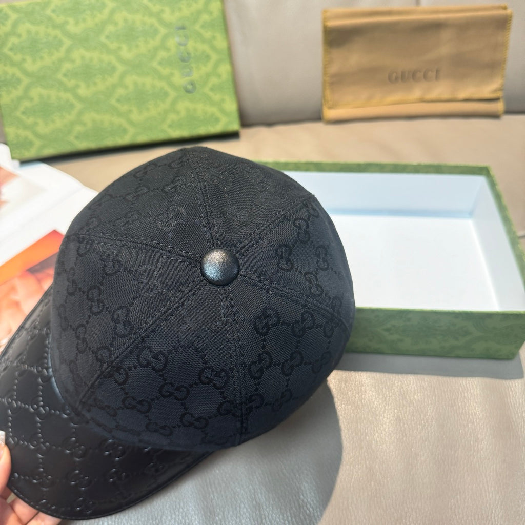 Dark navy GG monogram baseball cap crown with round button, curved brim