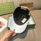 Gucci baseball cap in white with black interior lining and adjustable strap
