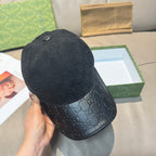 Dark navy GG monogram baseball cap with round top button and curved brim