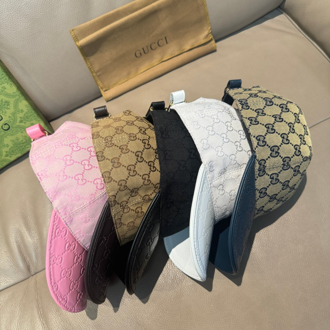 Gucci caps assortment: pink, tan GG, black, white, and blue caps