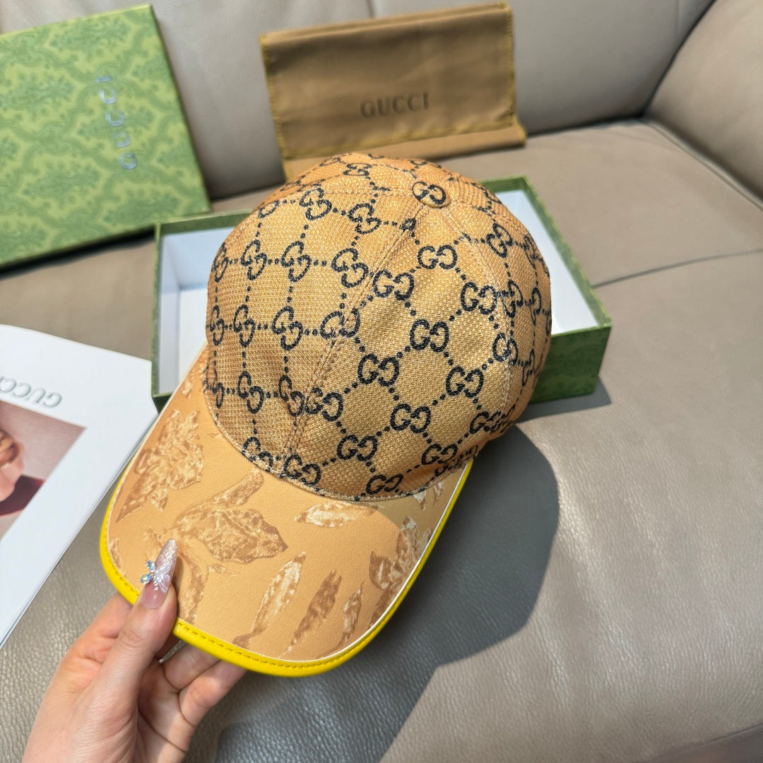 Tan GG monogram baseball cap with yellow-trim brim, front profile view