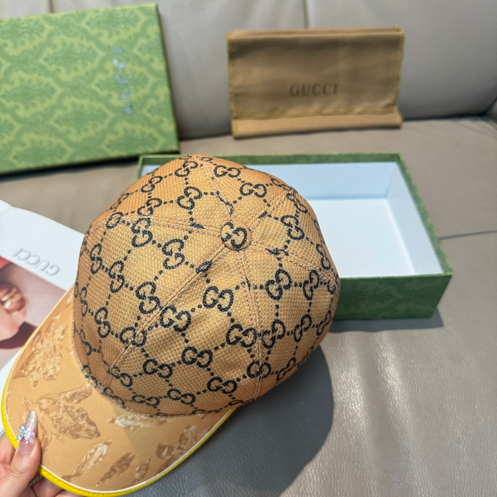 Tan GG monogram baseball cap with yellow-trim brim, side view