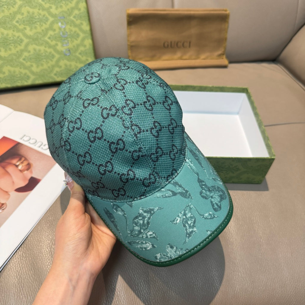 Gucci teal monogram baseball cap, side view with eagle print on brim