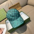 Gucci teal monogram baseball cap with embroidered eagle on curved brim