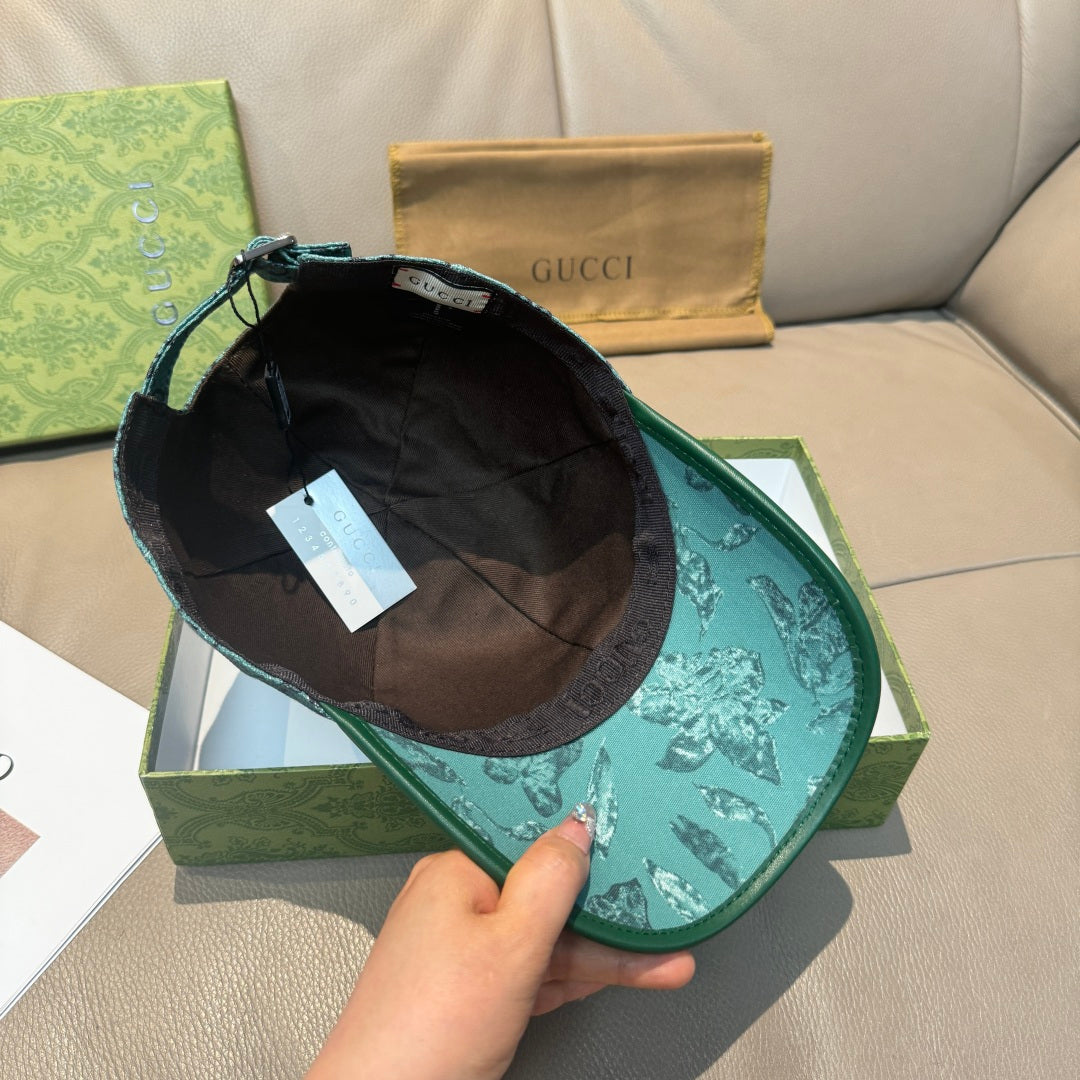 Gucci teal monogram cap shown from inside, visor and stitching visible