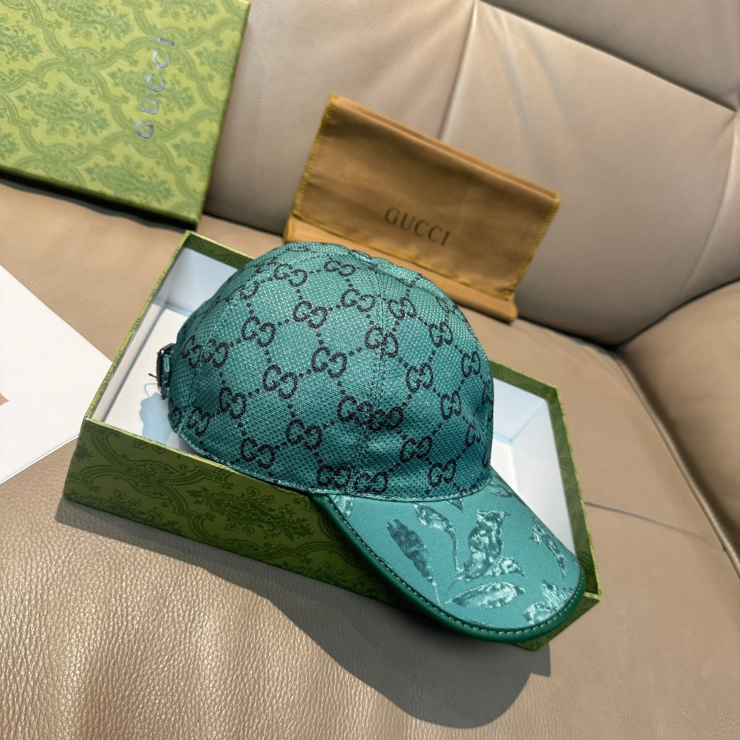 Gucci teal monogram baseball cap with glossy eagle motif on curved brim