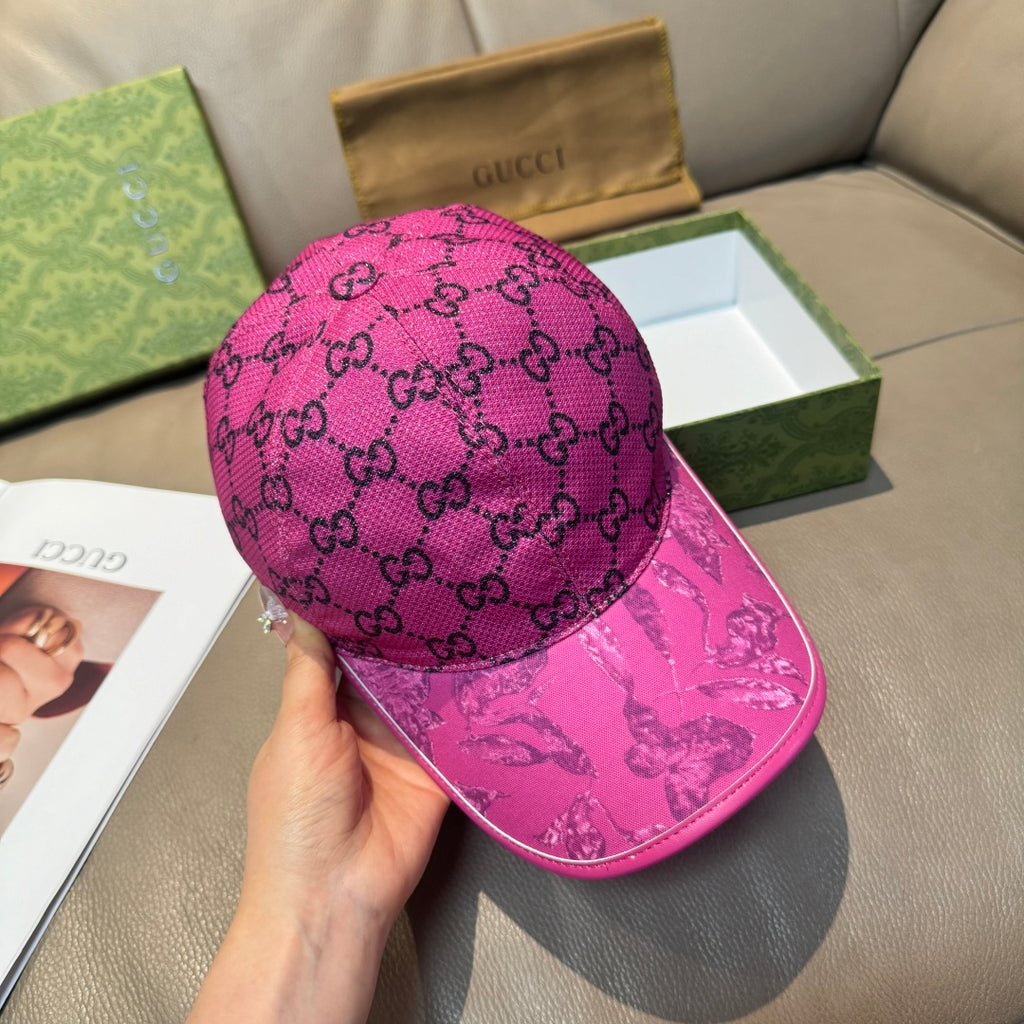 Gucci GG monogram cap in bright pink, worn with curved brim and front logo panel