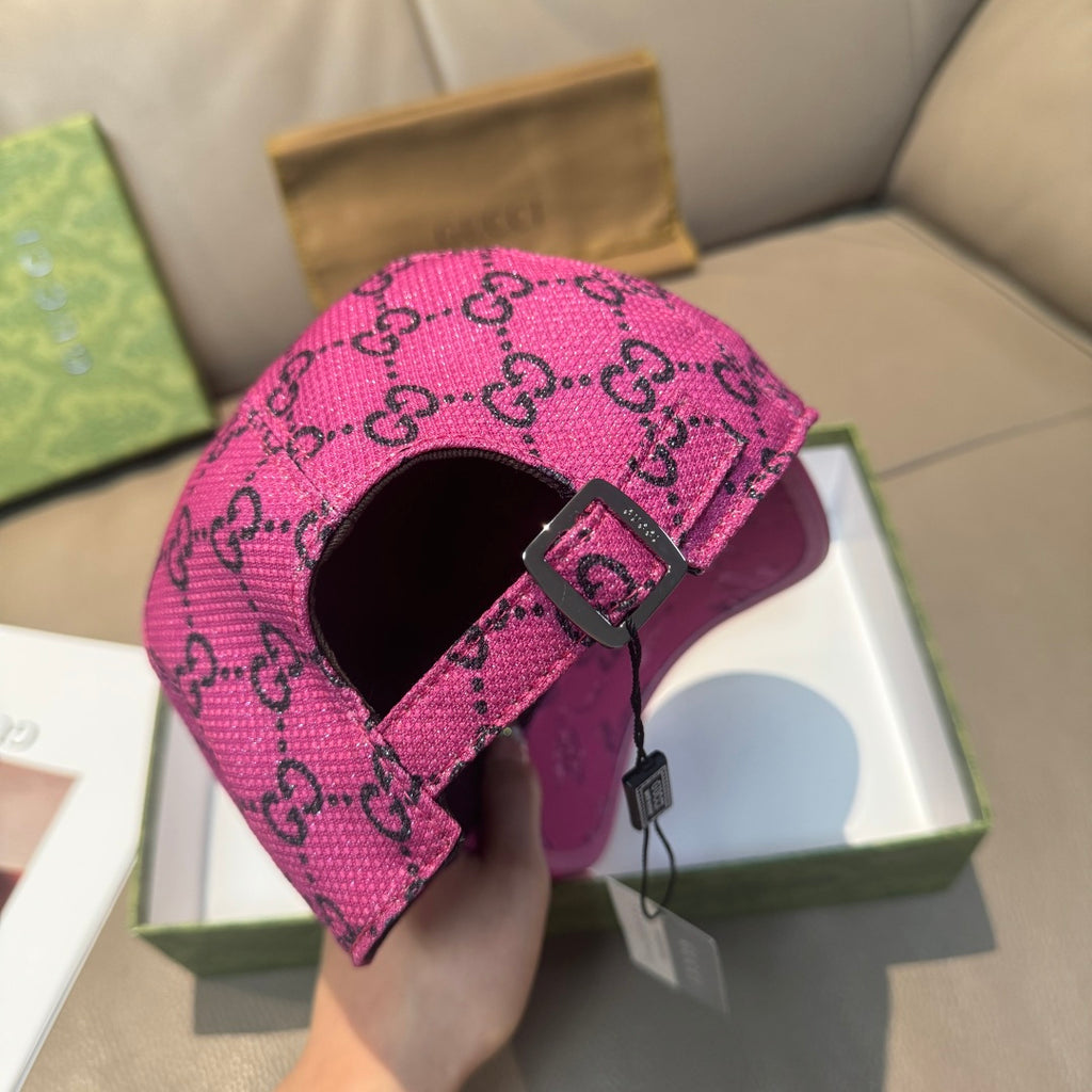 Gucci pink cap side view showing adjustable buckle strap and GG monogram fabric