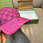 Gucci pink baseball cap with GG monogram fabric and embossed graphic front