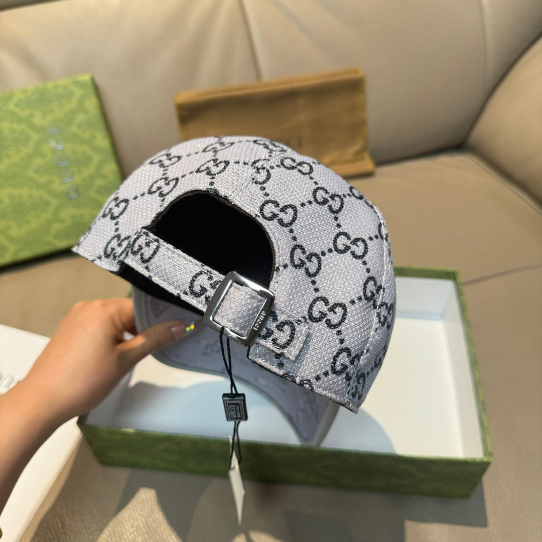 Gucci baseball cap back view with silver buckle on gray GG monogram crown.