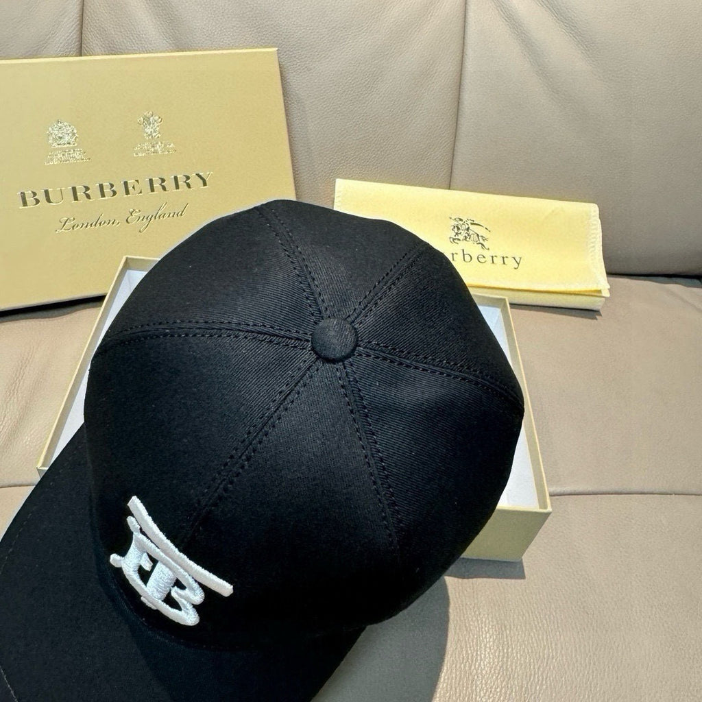 Black baseball cap with TB logo on side and stitched crown
