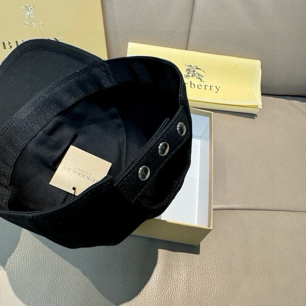 Black baseball cap interior view with adjustable strap and metal eyelets