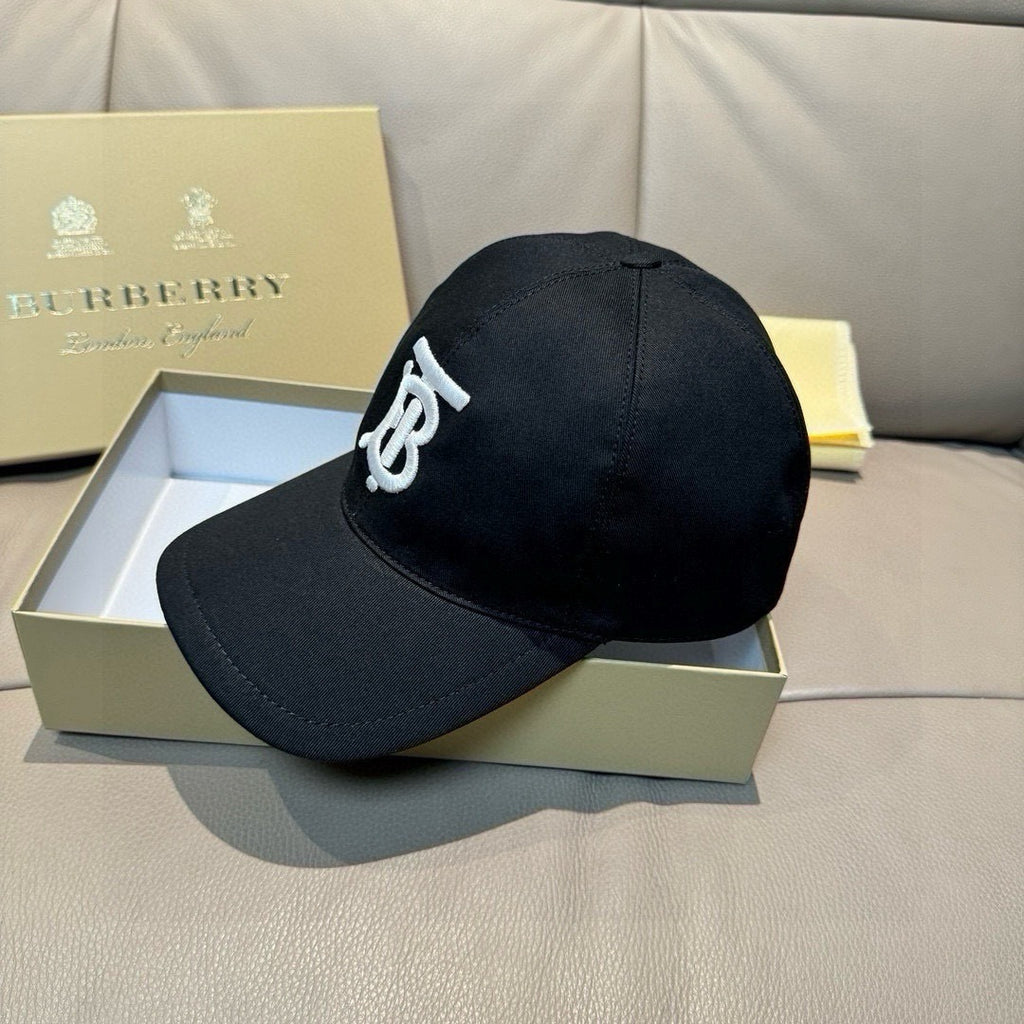 Black baseball cap with white TB logo and curved brim