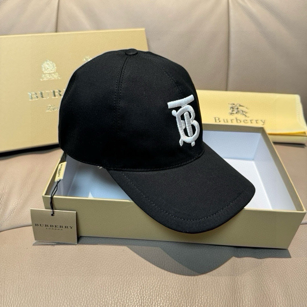 Black baseball cap with white TB logo, side profile
