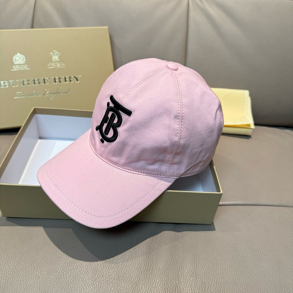 Pink baseball cap on display, front profile with black TB-style logo and curved brim