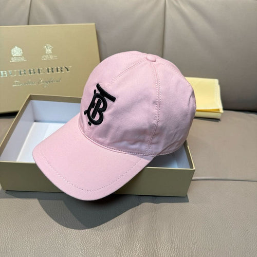 Pink baseball cap on display, front profile with black TB-style logo and curved brim