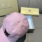 Pink baseball cap with top button detail and black TB-style logo on the front panel