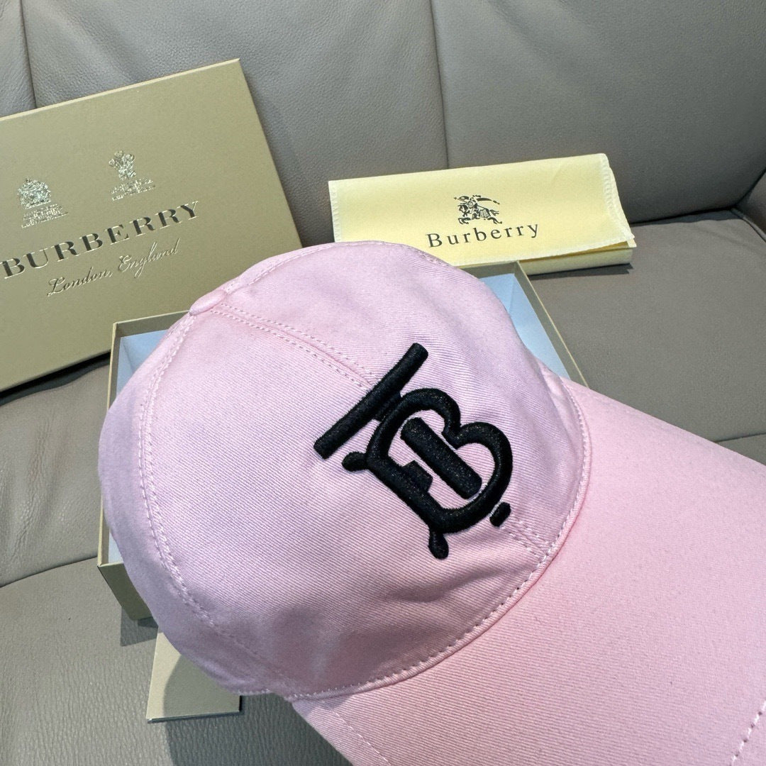 Pink baseball cap back view with black TB-style logo on the crown and curved brim