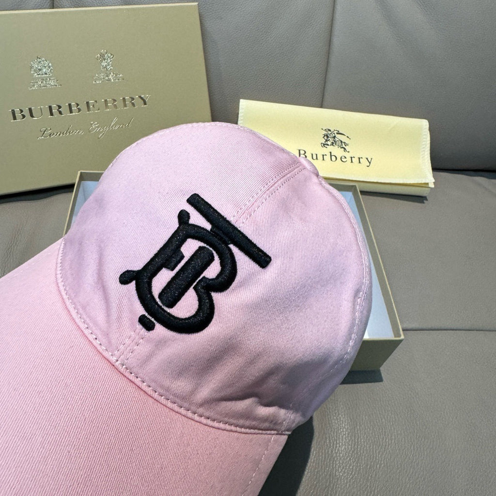 Pink baseball cap back view with black TB-style logo on the crown and curved brim