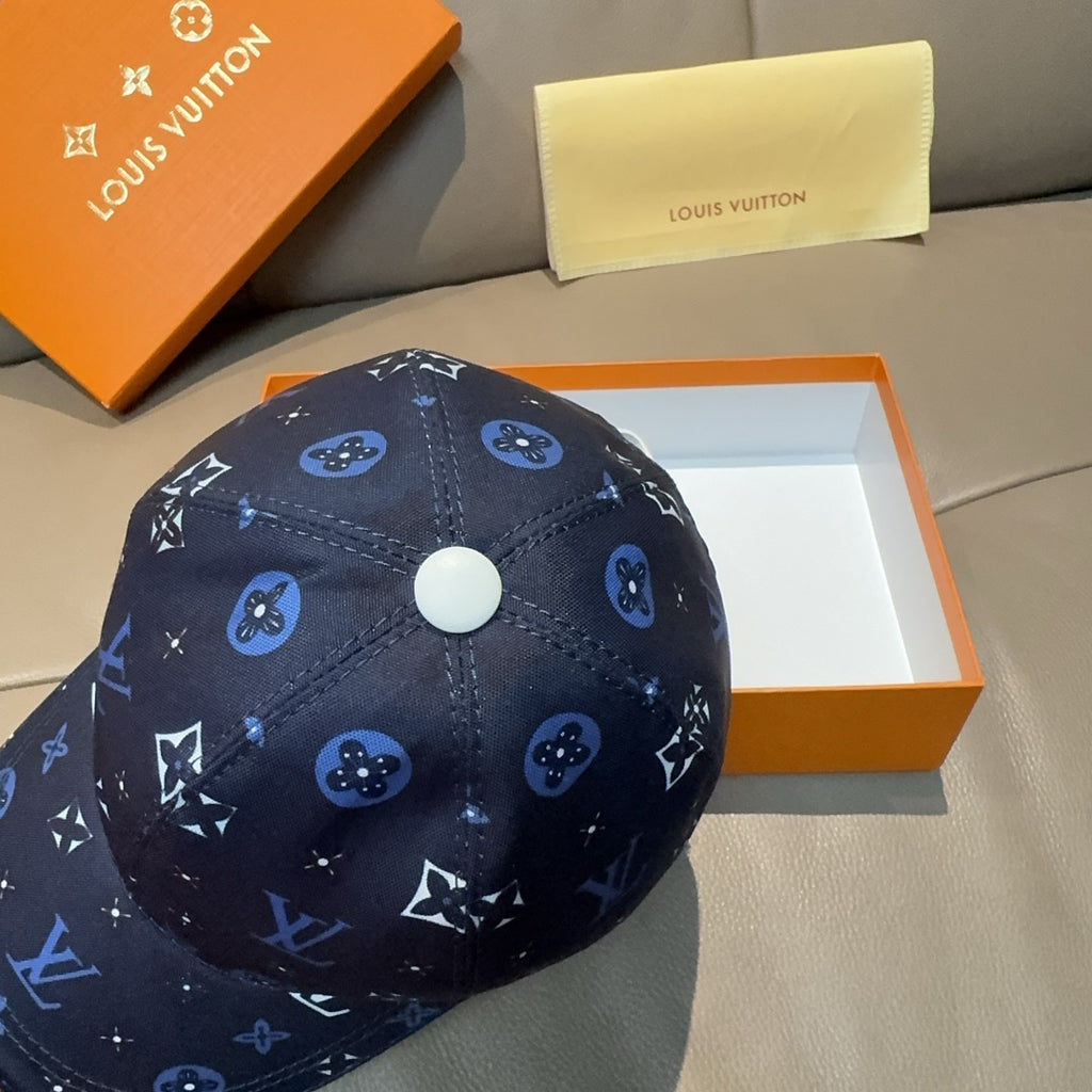 Louis Vuitton navy cap close-up showing blue monogram pattern and white button