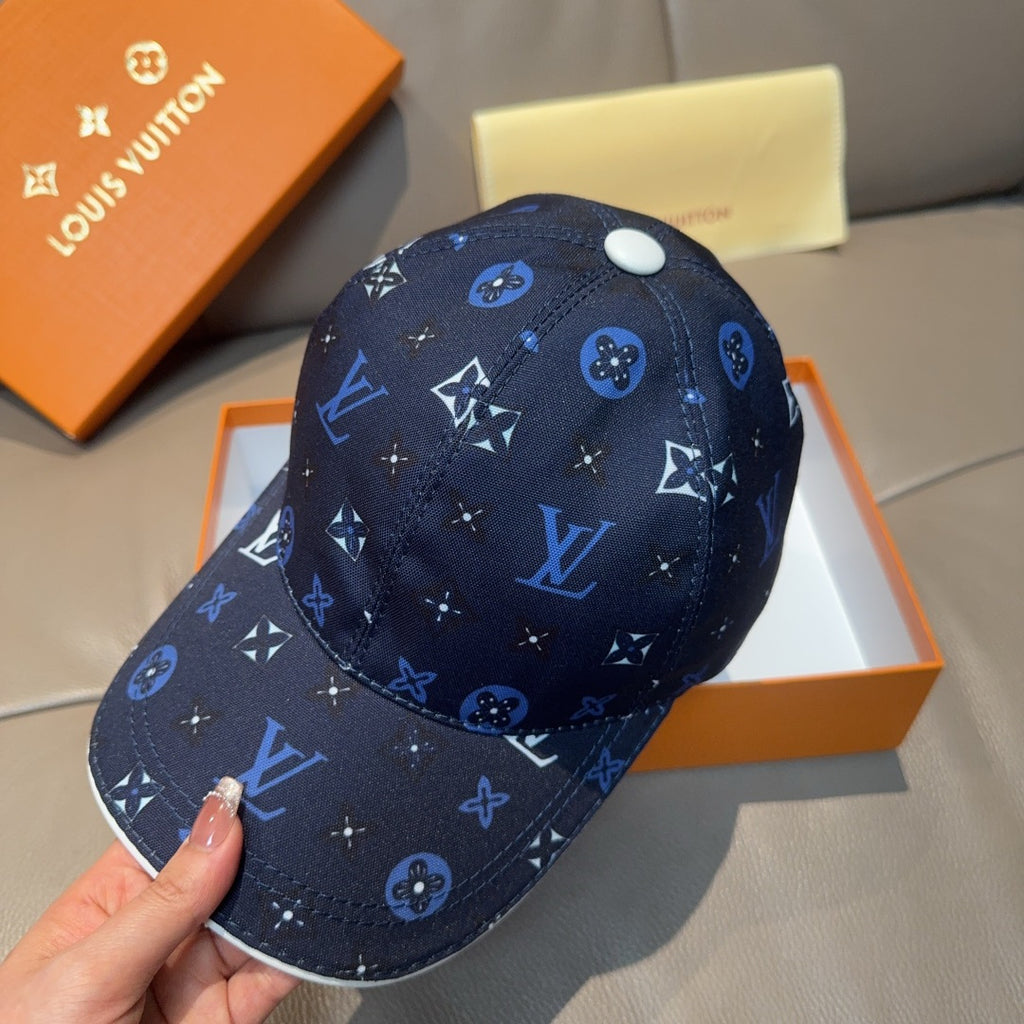 Louis Vuitton navy cap with repeating logo motifs in blue, white button on crown