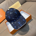 Louis Vuitton cap in dark navy with blue and white logo monogram pattern, curved brim