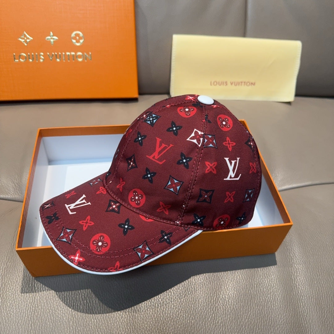 Louis Vuitton cap, dark red monogram print, side view with curved brim.