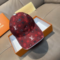 Louis Vuitton cap, dark red monogram print, curved brim.