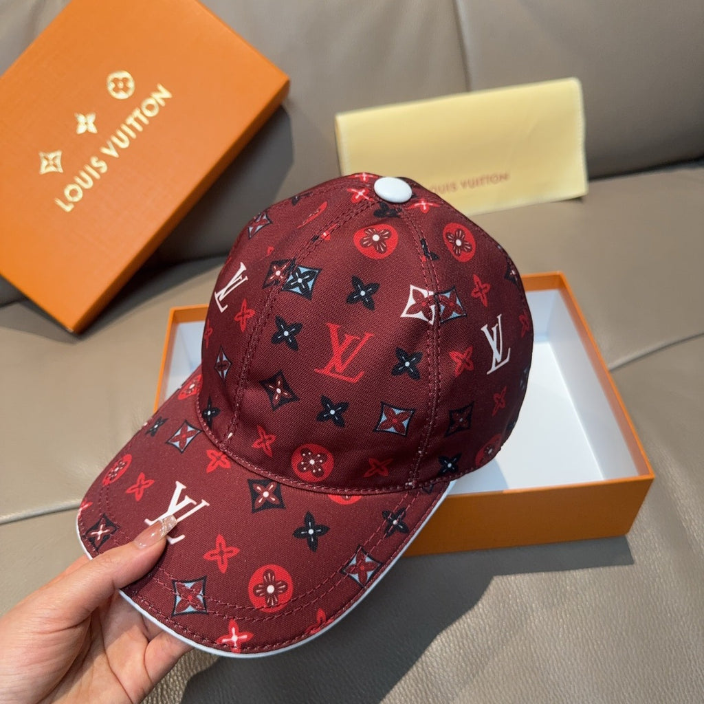 Louis Vuitton cap, dark red monogram print, hand-held side view.