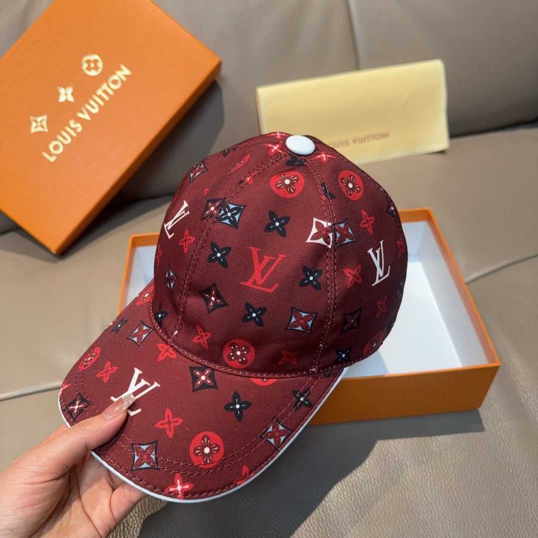 Louis Vuitton cap, dark red monogram print, hand-held side view.