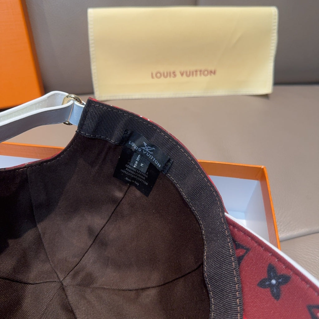 Louis Vuitton cap interior label and stitched brim edge, dark red monogram.