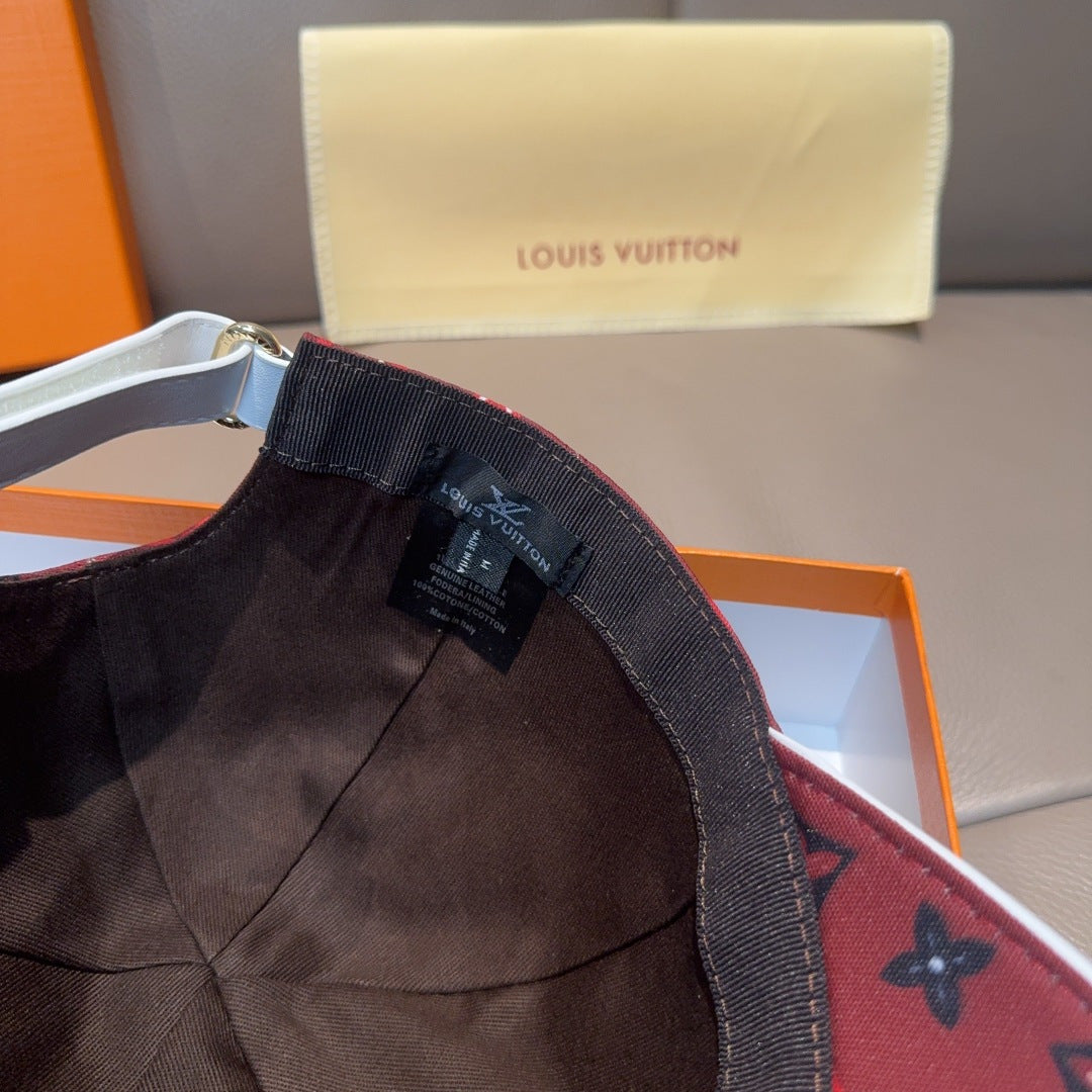 Louis Vuitton cap interior label and stitched brim edge, dark red monogram.