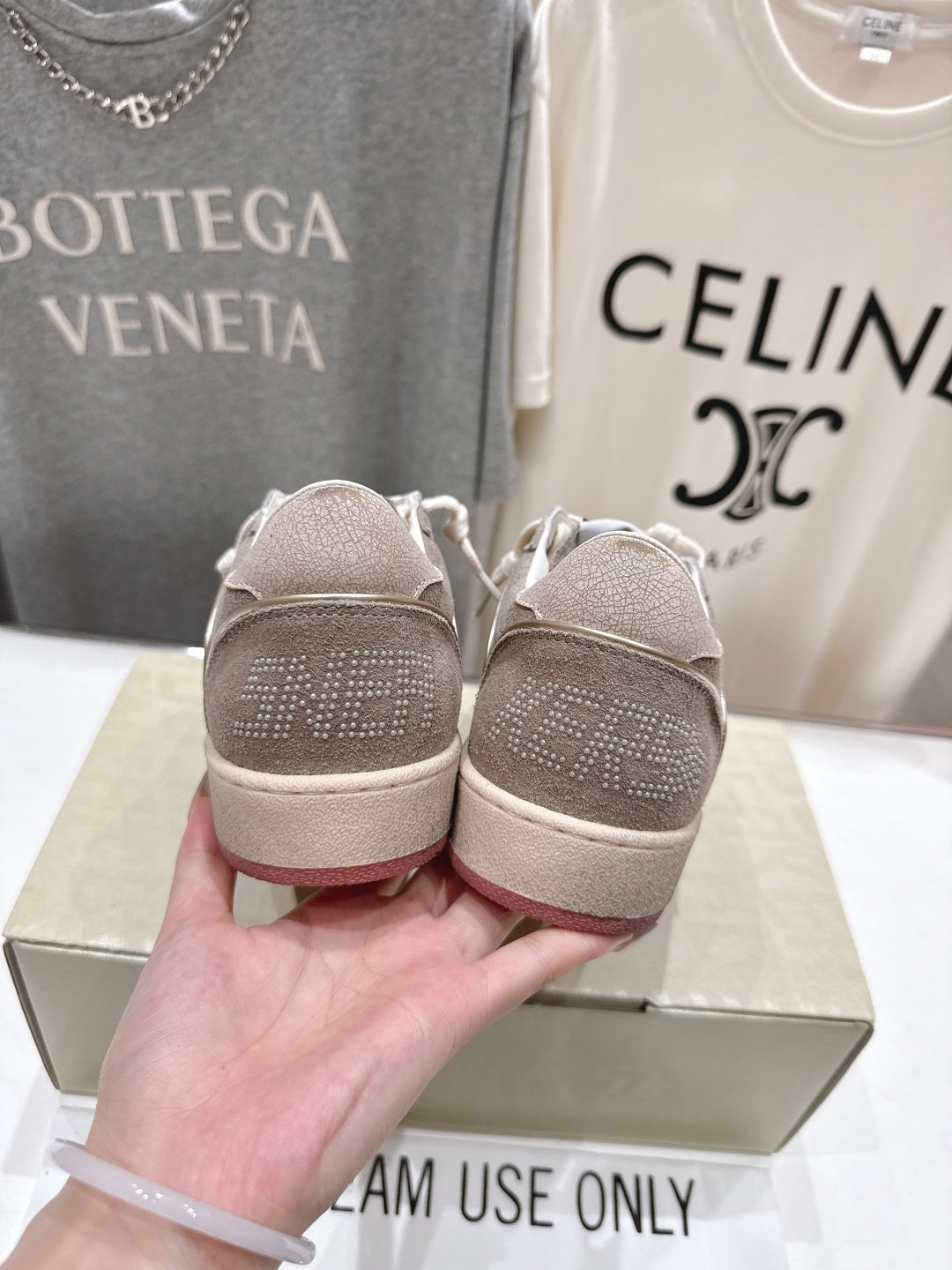 Golden Goose gray low-top sneakers with textured heel back detail